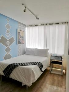 Postel nebo postele na pokoji v ubytování Kubo Hotel
