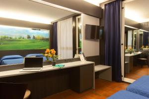 TV a/nebo společenská místnost v ubytování Hotel Pineta
