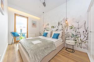 Posteľ alebo postele v izbe v ubytovaní Pomorskie Apartamenty Bernadowska Silver