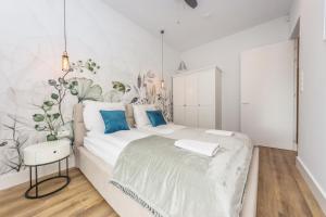 Posteľ alebo postele v izbe v ubytovaní Pomorskie Apartamenty Bernadowska Silver + 37 fotografií