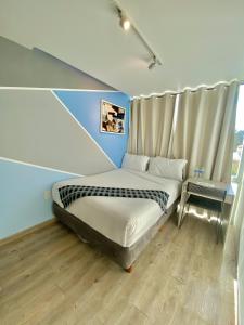 Postel nebo postele na pokoji v ubytování Kubo Hotel