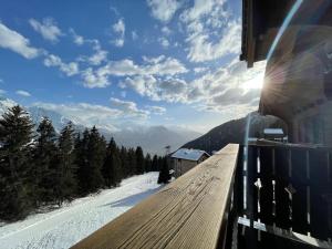 a view of a snow covered mountain from a building at Chalet Chumma Galeriewohnung in Riederalp