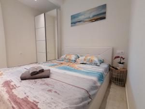 Postel nebo postele na pokoji v ubytování Sea Pleasure Apartment