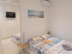 Postel nebo postele na pokoji v ubytování Sea Pleasure Apartment