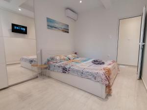 Postel nebo postele na pokoji v ubytování Sea Pleasure Apartment