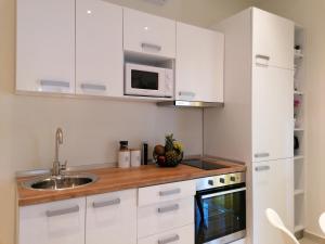 Kuchyň nebo kuchyňský kout v ubytování Sea Pleasure Apartment