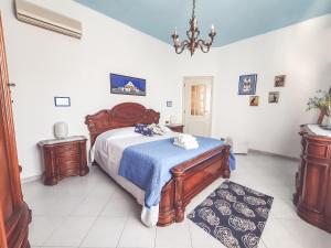 A bed or beds in a room at La Borgata