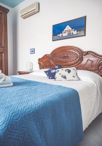 A bed or beds in a room at La Borgata