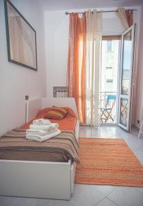 A bed or beds in a room at La Borgata