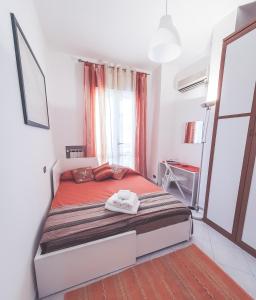 A bed or beds in a room at La Borgata
