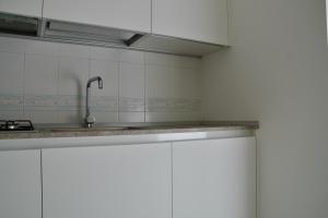 Η κουζίνα ή μικρή κουζίνα στο Appartamento AL CENTRO +29 φωτογραφίες