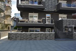 a large building with a staircase in front of it at Princess Luxury Suite 2 in Paralia Katerinis