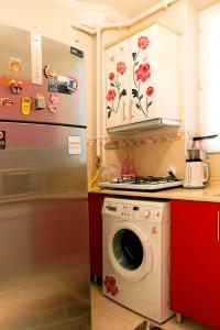a kitchen with a refrigerator and a washing machine at Best location in İstanbul in Istanbul