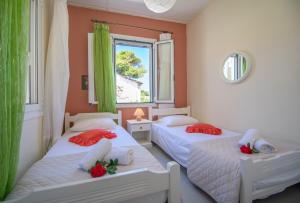 Postel nebo postele na pokoji v ubytování Dora's Tsilivi Beach House A by "elite" + 18 fotografií