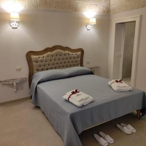 Postelja oz. postelje v sobi nastanitve Palazzo Palasciano