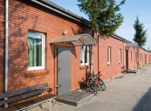 a brick building with a bike parked next to a door at Hostel Siennicka in Warsaw