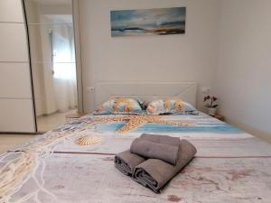 Postel nebo postele na pokoji v ubytování Sea Pleasure Apartment