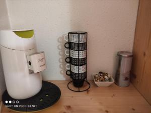 a blender sitting on a counter next to a wall at Studio 4 personnes + parking privé in Cauterets