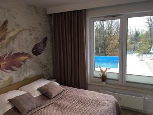 Posteľ alebo postele v izbe v ubytovaní Apartament S&S Nadmorskie Tarasy Kołobrzeg D302 + 35 fotografií