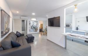 Televízia a/alebo spoločenská miestnosť v ubytovaní Apartamento "Alexia" en San Agustin
