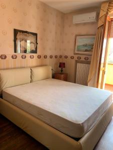 Ένα ή περισσότερα κρεβάτια σε δωμάτιο στο il Giardino di Sirius