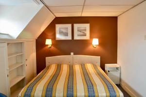 Postel nebo postele na pokoji v ubytování Hotel De Stern