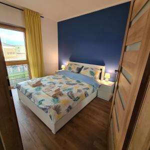 Posteľ alebo postele v izbe v ubytovaní Apartament Słoneczne Nabrzeże