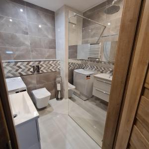 Kúpeľňa v ubytovaní Apartament Słoneczne Nabrzeże + 13 fotografií