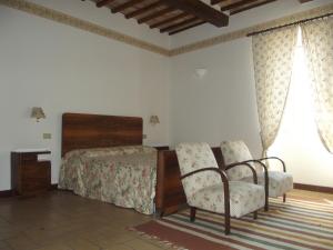 Tempat tidur dalam kamar di Agriturismo Villa Gabbiano