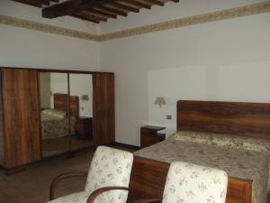 A bed or beds in a room at Agriturismo Villa Gabbiano