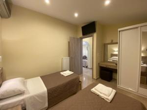 a hotel room with a bed and a mirror at Villa Valmas Private Escape in Skiathos +16 photos