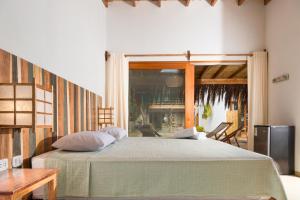מיטה או מיטות בחדר ב-ALAS Y ARENA
