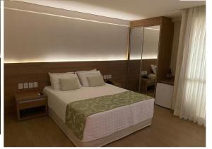 Krevet ili kreveti u jedinici u objektu Condomínio Vista Azul hotel