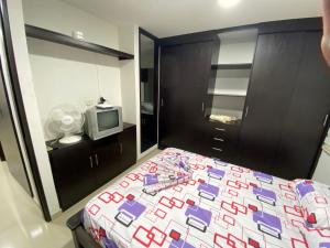 Postel nebo postele na pokoji v ubytování Apartamento Villavicencio Elegante + 17 fotografií