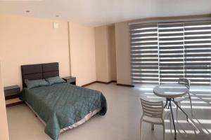 Ένα ή περισσότερα κρεβάτια σε δωμάτιο στο Lujoso apartamento en zona exclusiva!