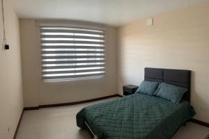 Ένα ή περισσότερα κρεβάτια σε δωμάτιο στο Lujoso apartamento en zona exclusiva!