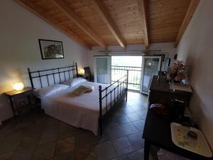 a bedroom with a bed and a balcony at Le Fiabe in Sestri Levante