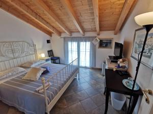 a large bedroom with a bed and a desk at Le Fiabe in Sestri Levante
