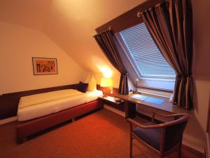 Tempat tidur dalam kamar di Hotel Schlair