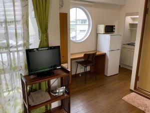 Kuchyň nebo kuchyňský kout v ubytování Asahi21 Asahibashi-Ekimae