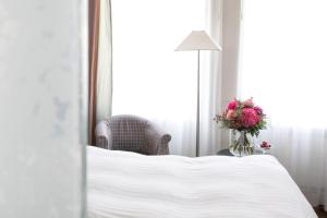 Postel nebo postele na pokoji v ubytování Hotel Metropol
