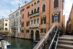 a view of a canal with a building and a bridge at Locanda Cà Le Vele in Venice