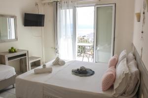 Postel nebo postele na pokoji v ubytování Iason Apartments