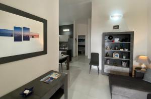 a living room with a couch and a table at Cala Gonone - Casa del Mirto in Cala Gonone