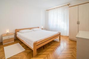 Posteľ alebo postele v izbe v ubytovaní Apartments Ana S