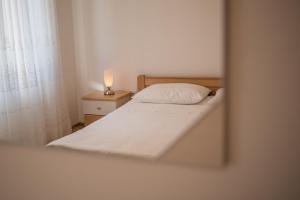 Posteľ alebo postele v izbe v ubytovaní Apartments Ana S
