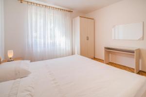 Posteľ alebo postele v izbe v ubytovaní Apartments Ana S