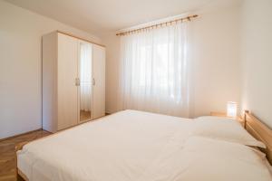 Posteľ alebo postele v izbe v ubytovaní Apartments Ana S