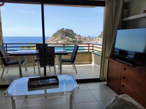 a room with a table and a view of the ocean at Girbal Terrace in Tossa de Mar
