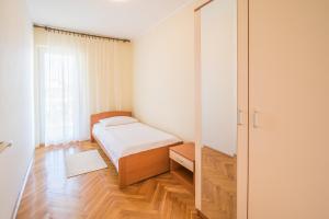Posteľ alebo postele v izbe v ubytovaní Apartments Ana S